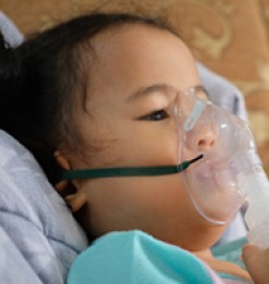 A child wearing an oxygen mask